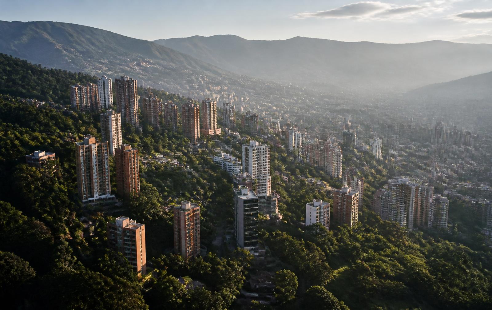 Aerial daylight view of El Poblado, Medellín surrounded by green hills